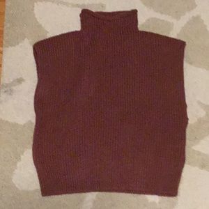 Sleeveless turtleneck light colored maroon knit shirt
